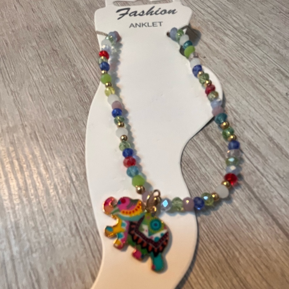 Multi color bead anklet with elephant.  Costume jewelry as shown.